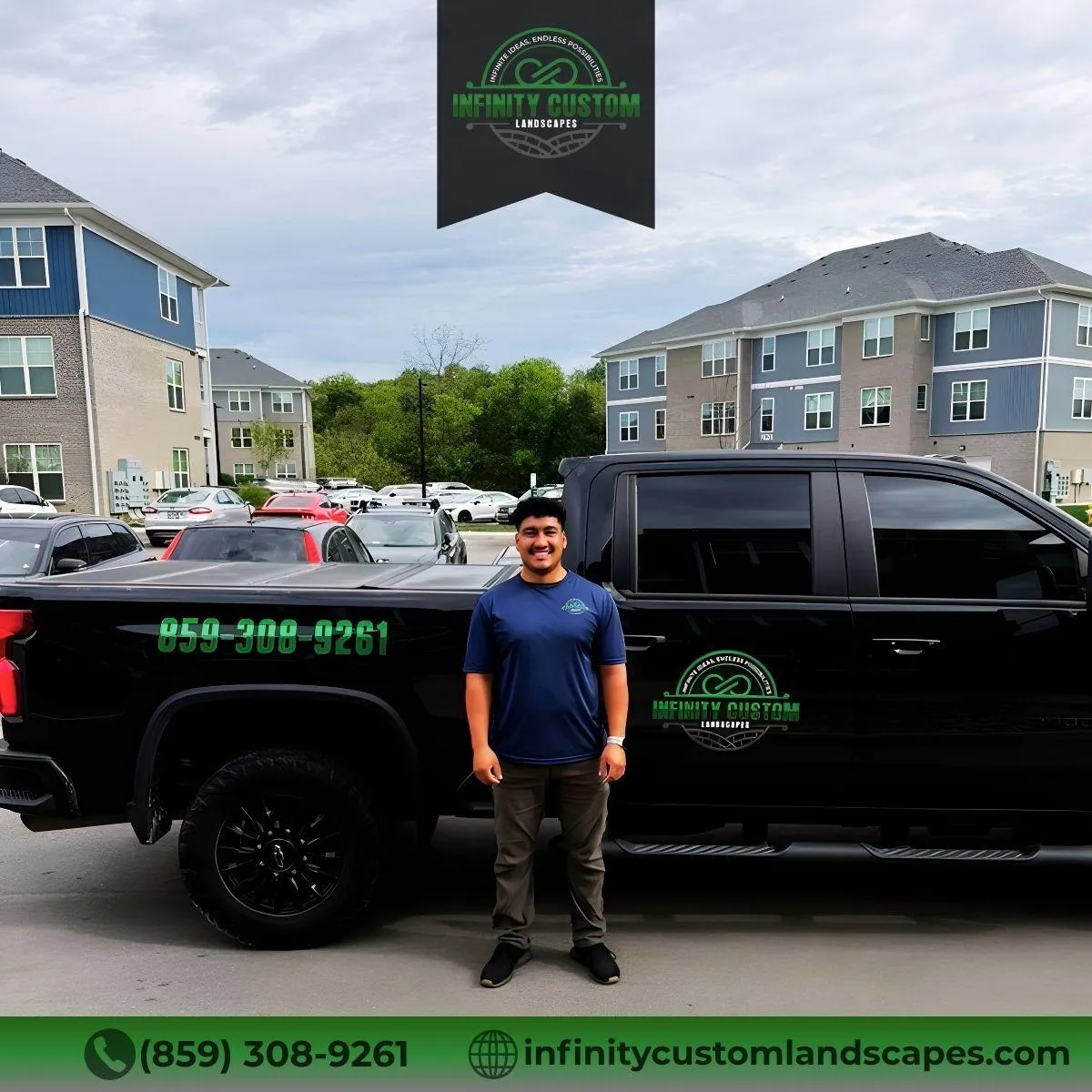 Infinity Custom Landscapes team member beside branded truck in Alexandria KY, providing professional landscape design and installation services.
