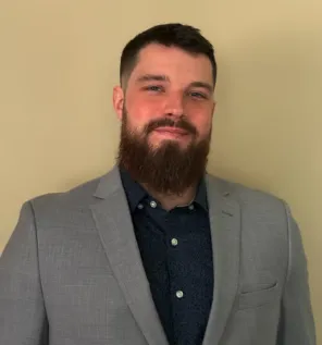 Portrait of Jordan Rivera, confident professional, mid-30s, business casual, soft studio lighting, neutral background, full face and shoulders visible, cropped square for profile use.