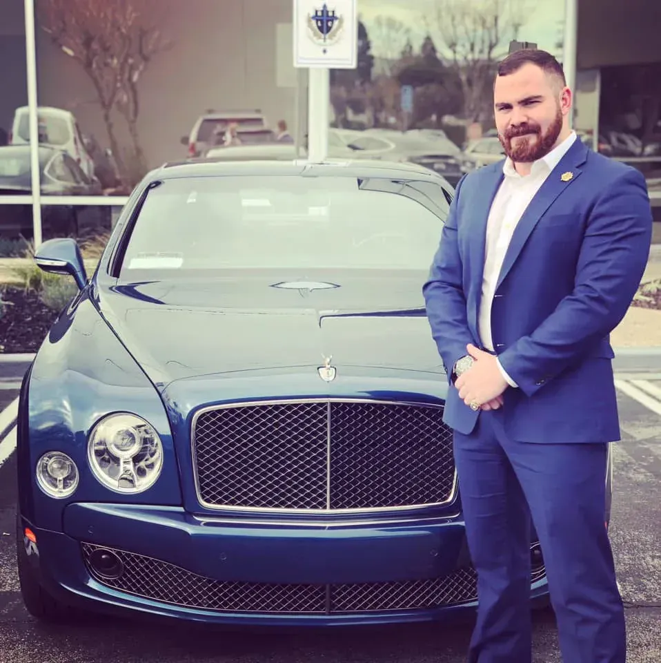 2014 milestone: ribbon-cutting with a mid-aged female executive holding scissors and smiling