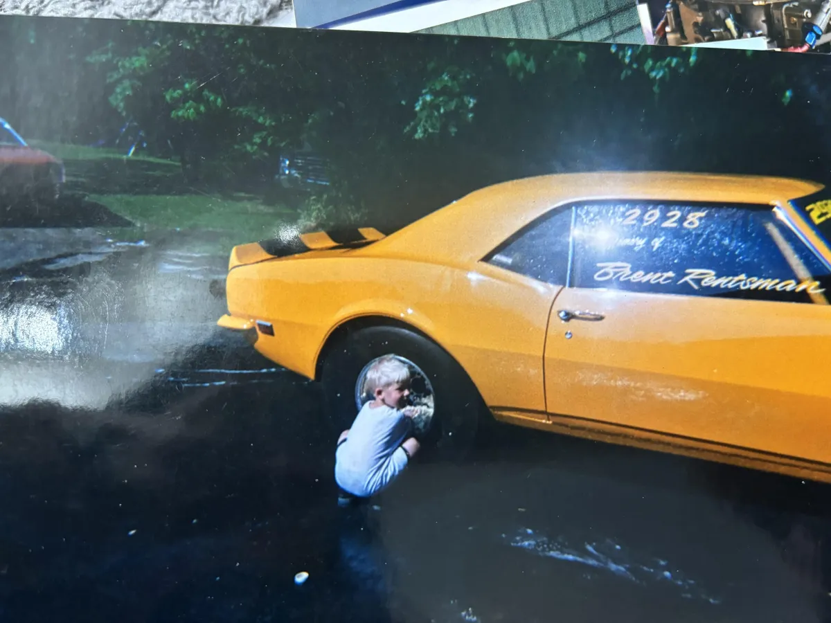 Adam Yellow Car Fixing Tire