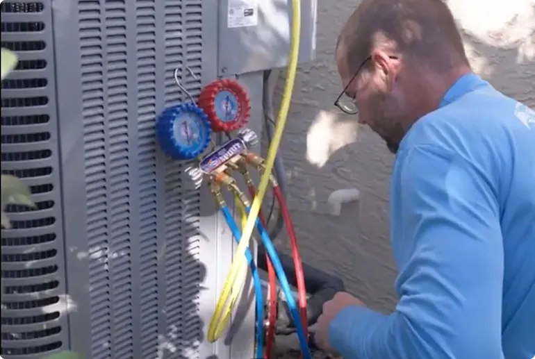 Air conditioning technician servicing AC unit in Oldsmar FL