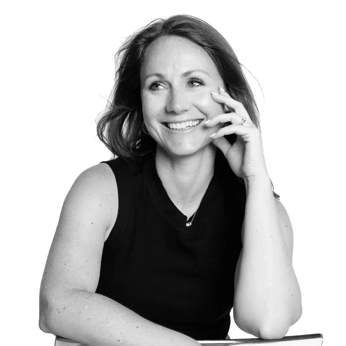 Confident female entrepreneur in soft natural light, three-quarter view, modern minimalist studio.