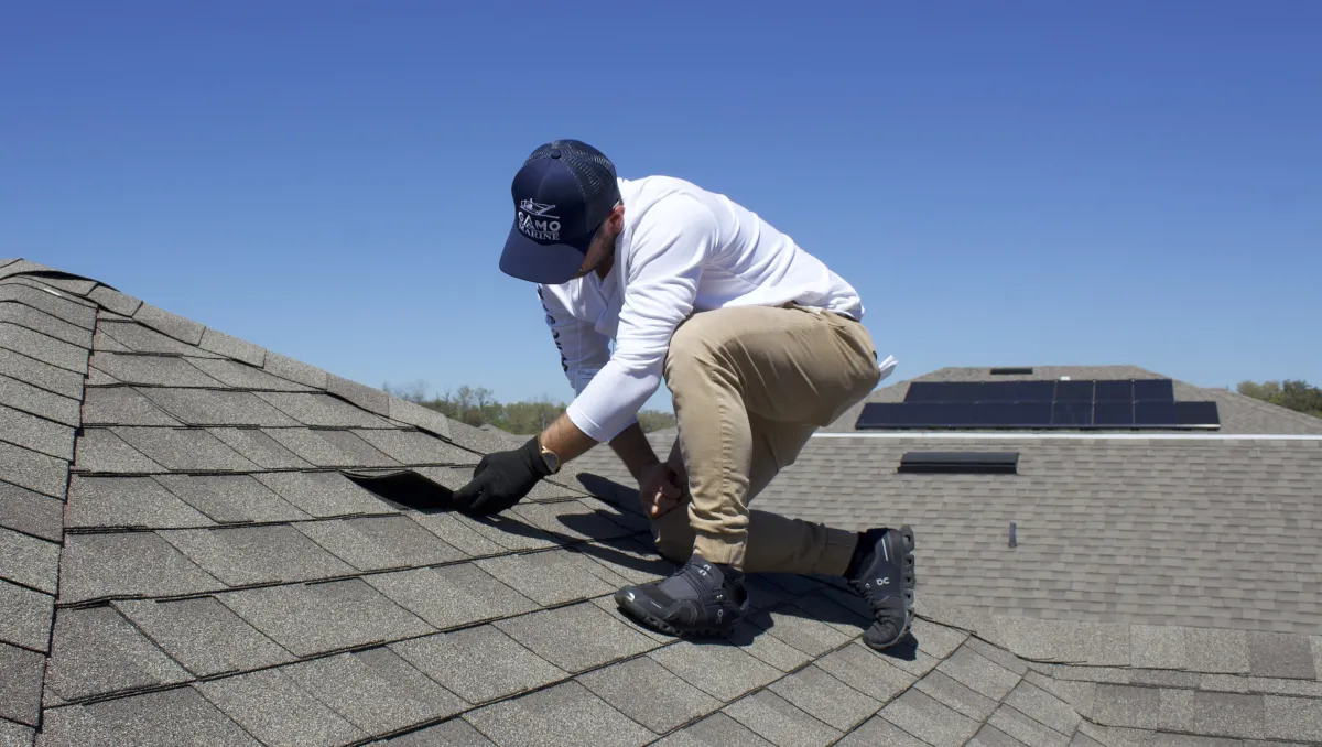 two hands touching each other in front of a pink background