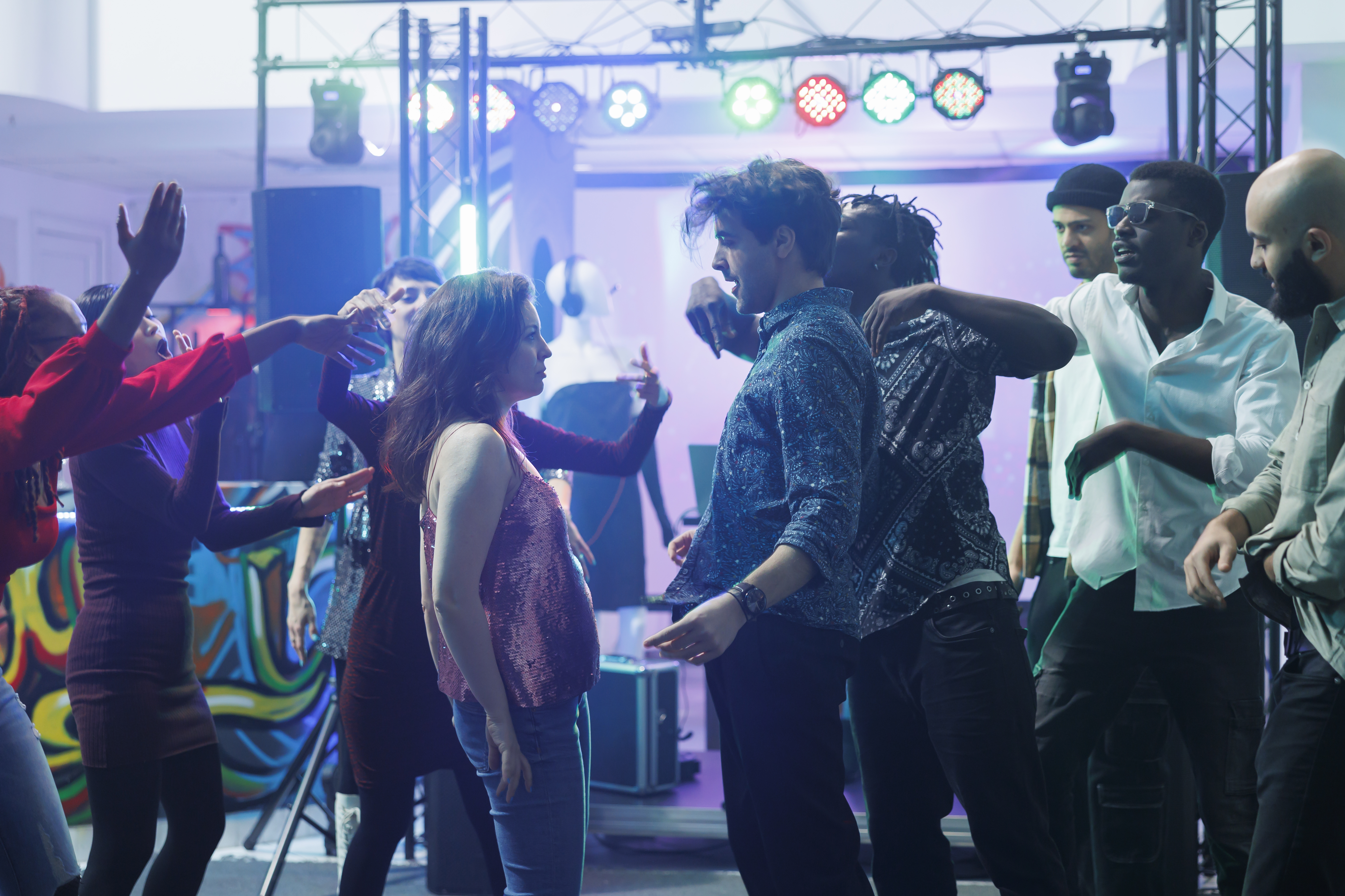 Students dancing at a school event with professional DJ lighting and sound