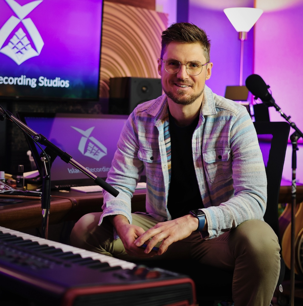 Joseph Cheek at Island Recording Studios with purple lights in the background