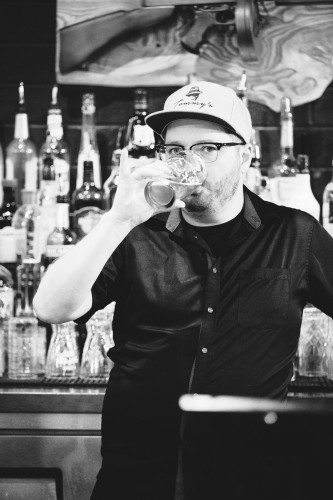 Curtis drinking a beer on the job