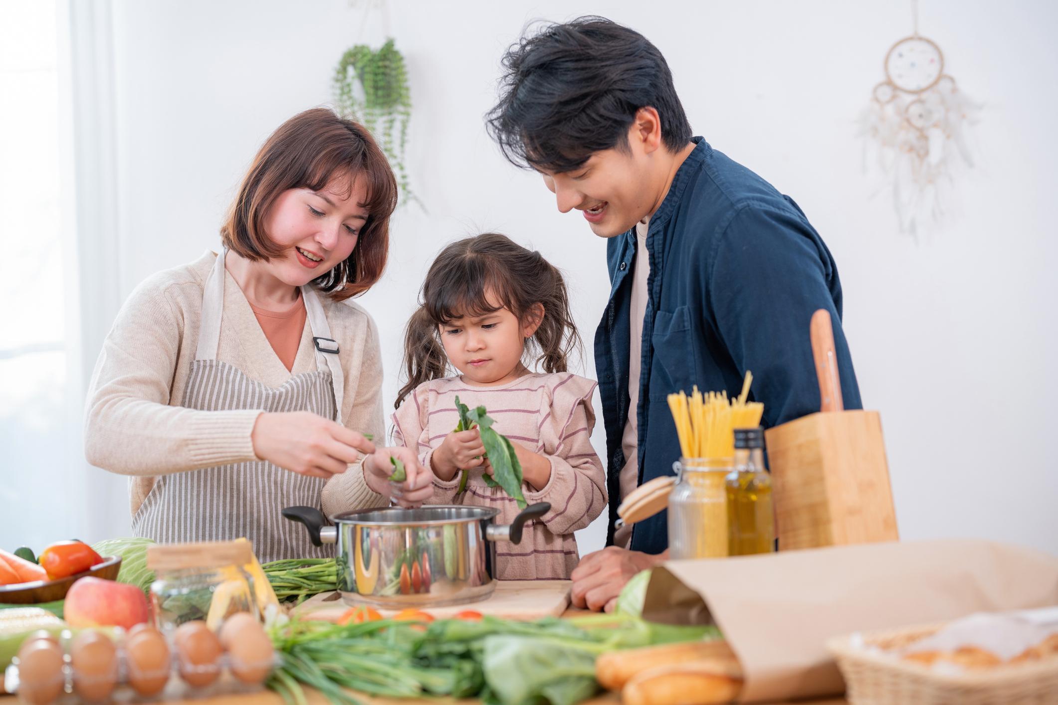 family preparing vegetables