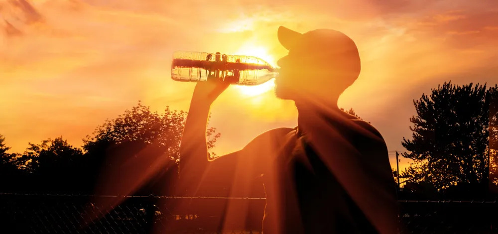attractive-slim-woman-doing-sport-exercises-morning-sunrise-beach-sports-wear-thirsty-drinking-water-bottle-healthy-lifestyle-listening-music-wireless-earphones-smiling-happy