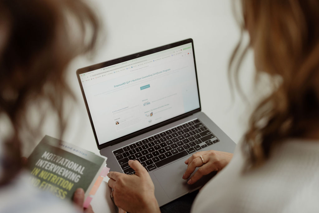 clients scolling glp-1 funnel page on the laptop