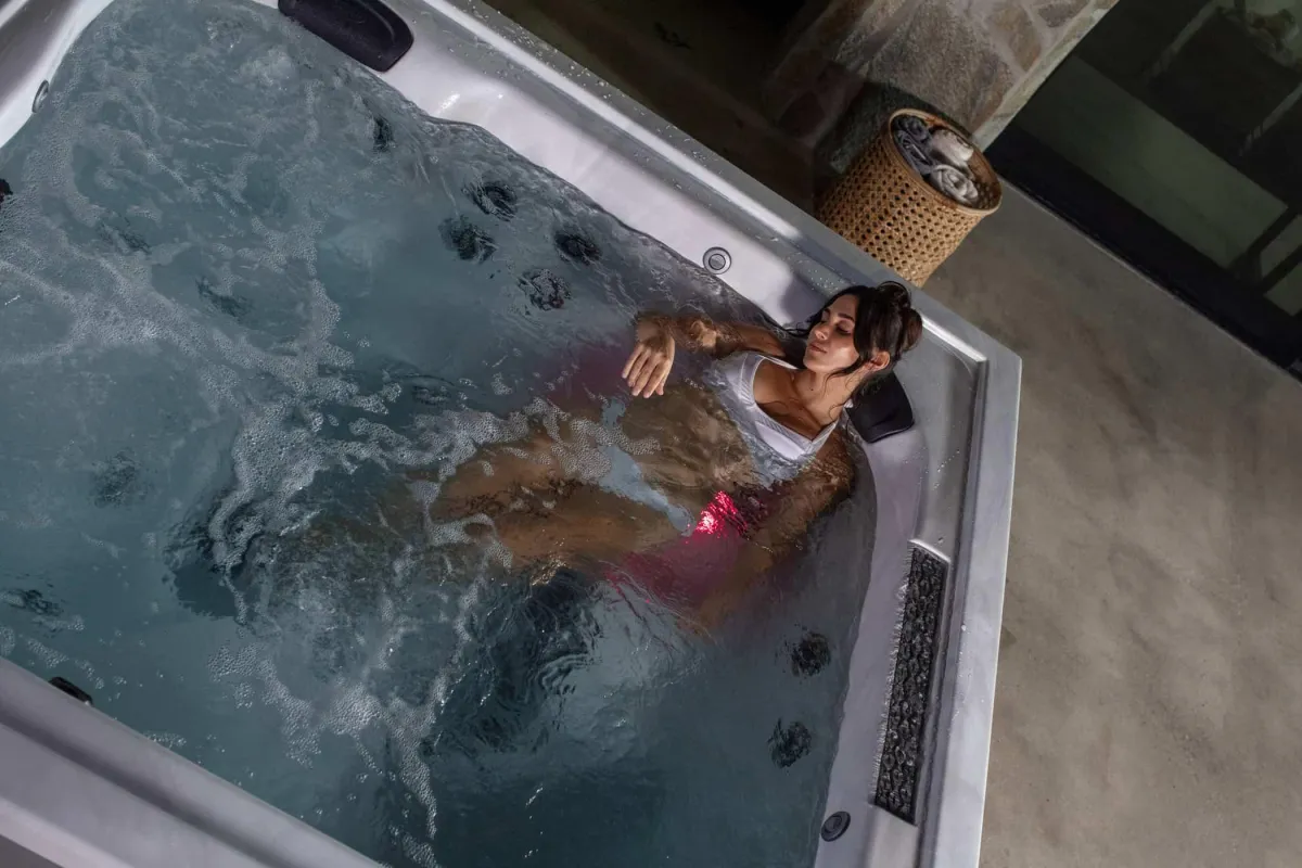 Woman relaxing in a hot tub