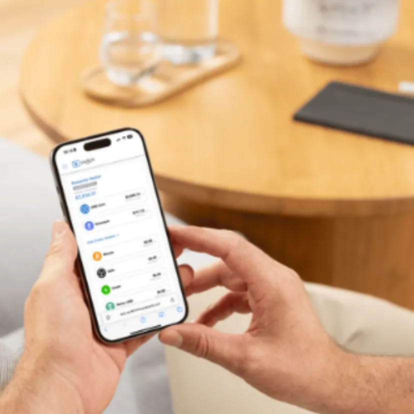 Desktop trading charts on a laptop with hands mid-gesture