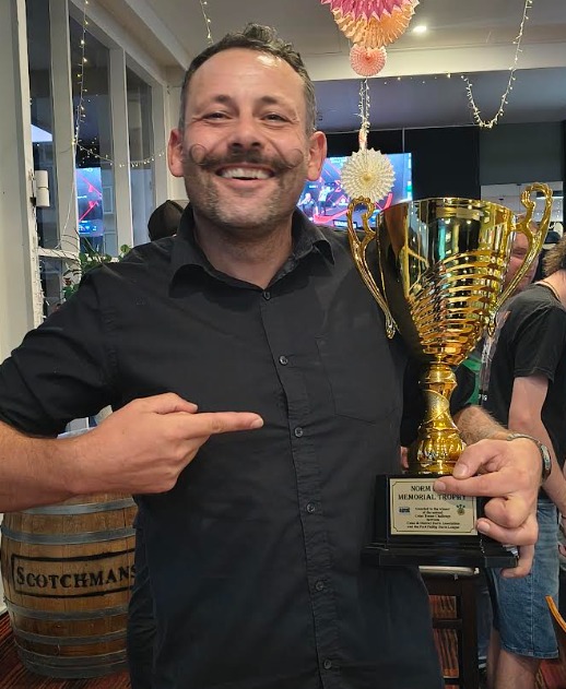 Darts player focusing during summer singles competition