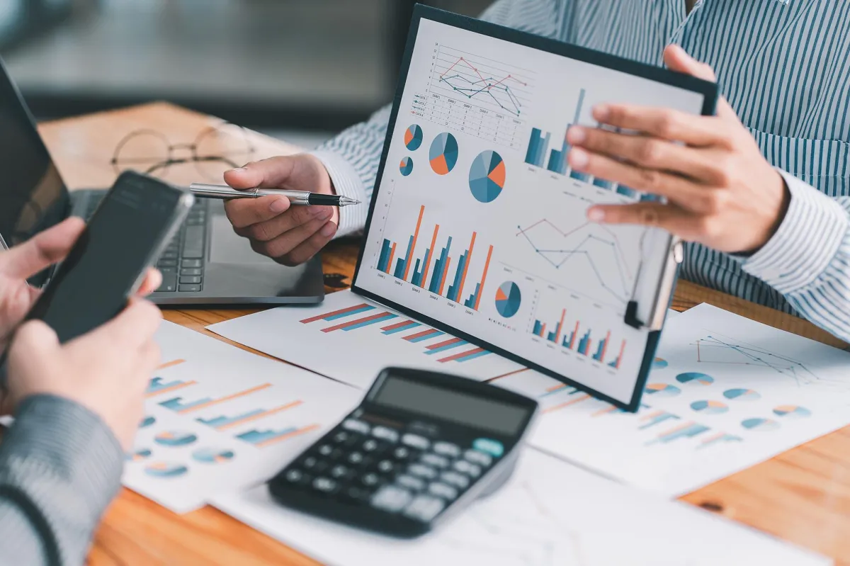 Financial advisors reviewing charts, graphs, and reports during a planning session – Stonebridge Wealth Systems process