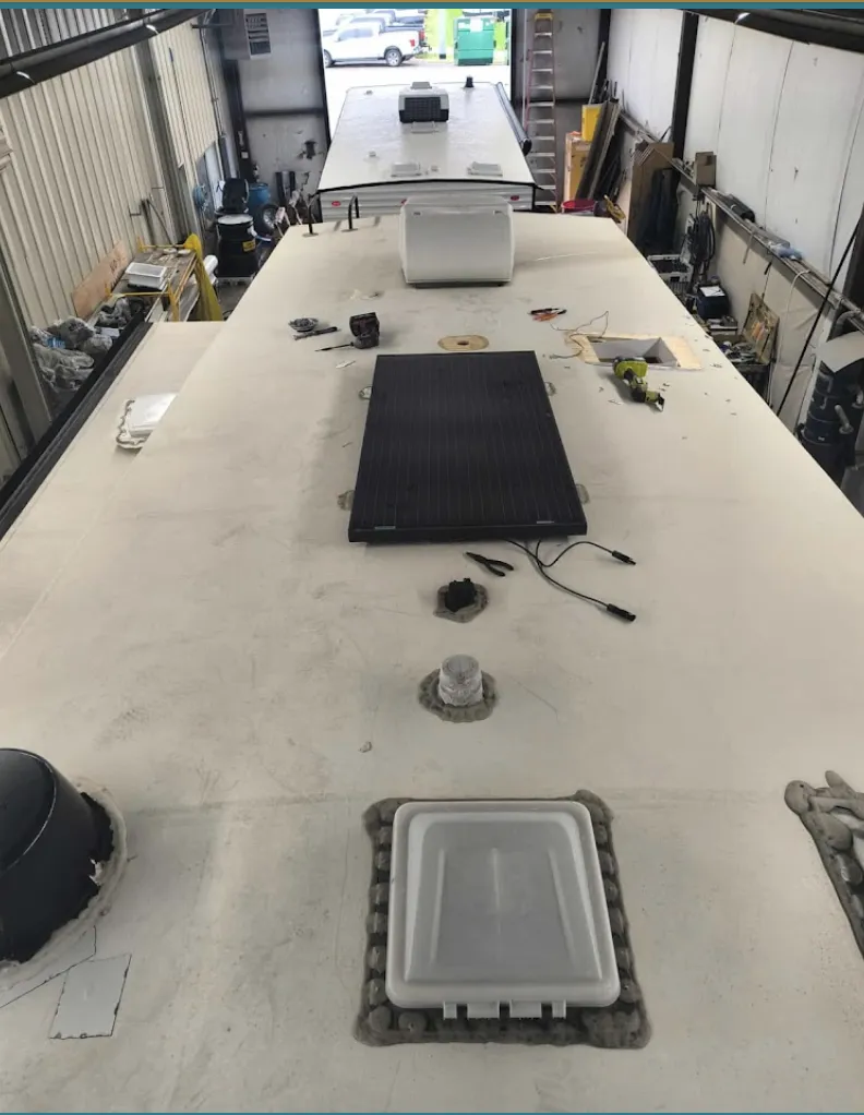 a man with tattoos on his arm and a woman with a microphone