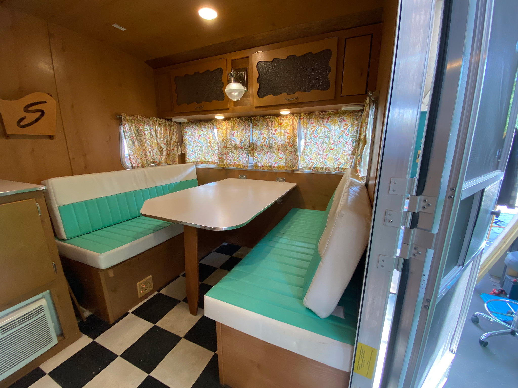 a painting of pink and green with blue and white dots