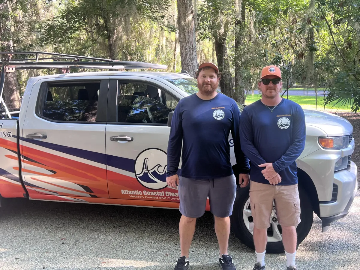 Devon Swanson and Levi Greene, owners of Atlantic Coastal Cleaning, with the company truck in Brunswick, GA