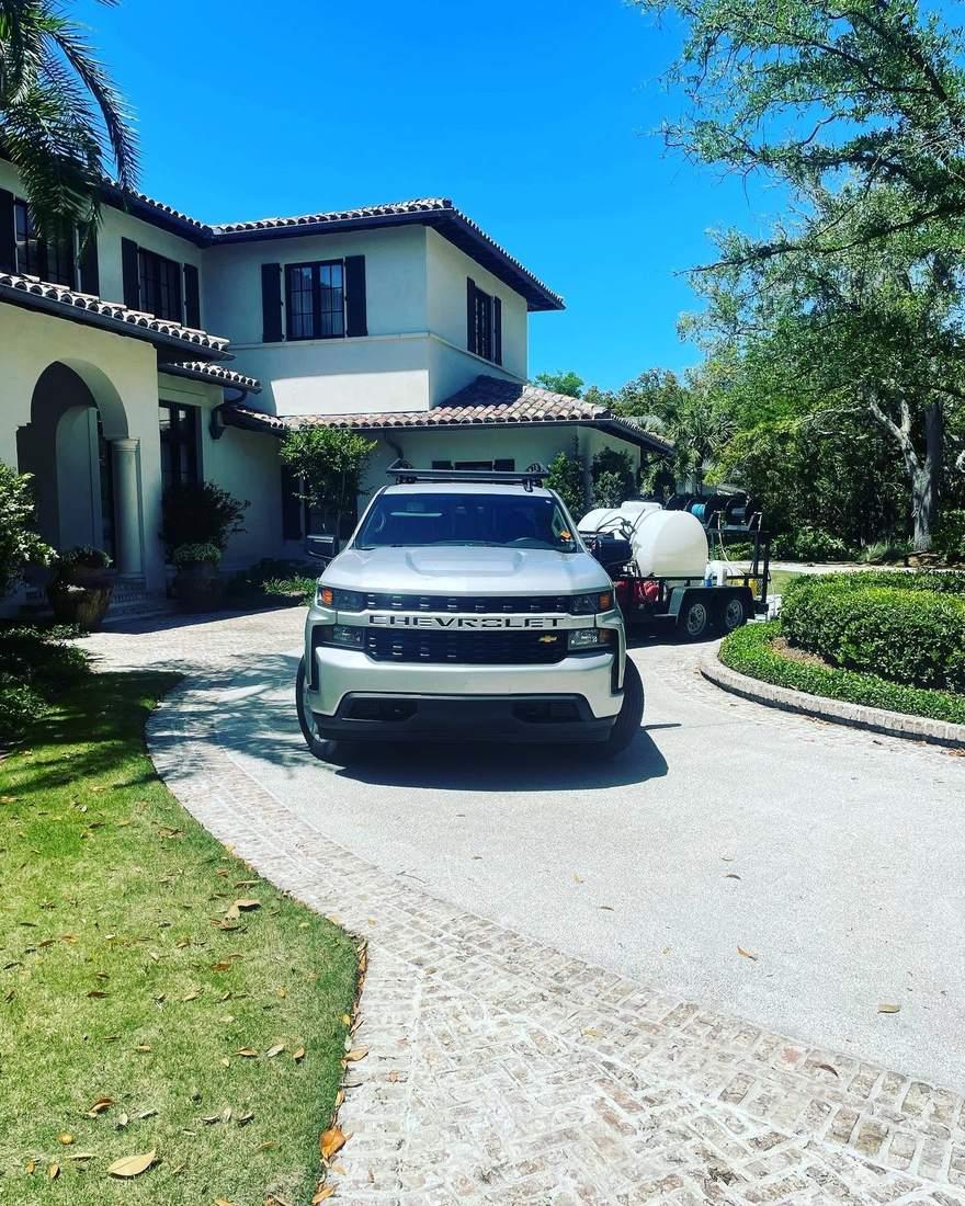 Soft wash rig parked at a stucco home on Sea Island, Georgia