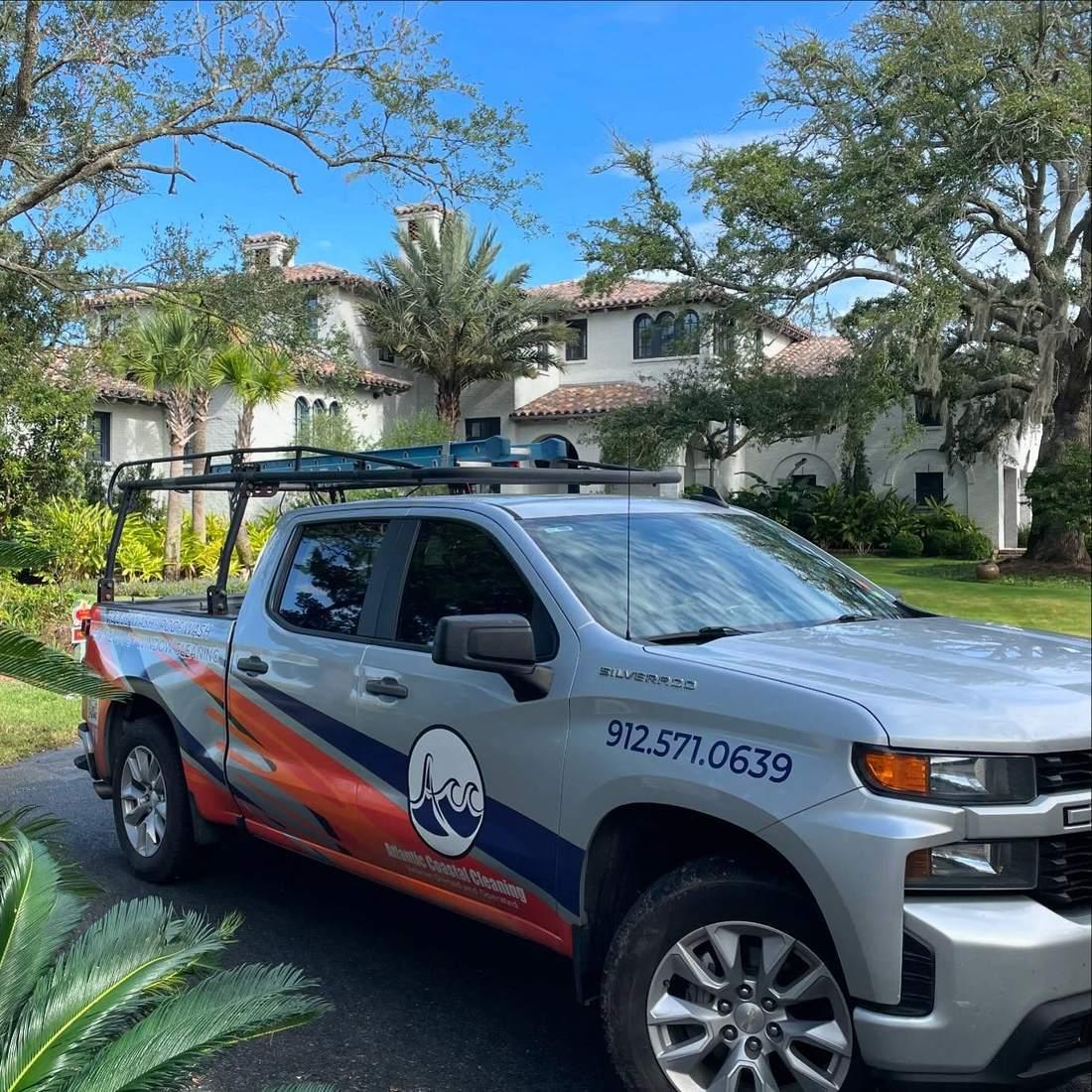 Atlantic Coastal Cleaning truck at a stucco home on Sea Island, Georgia