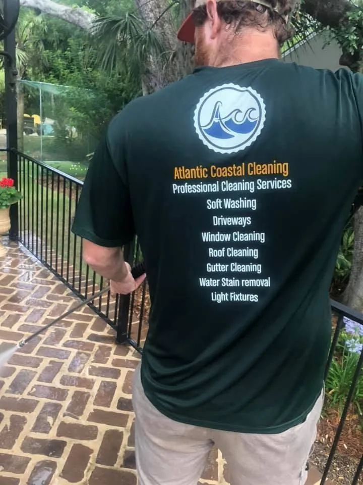 Atlantic Coastal Cleaning technician on a freshly washed paver patio, St. Simons Island GA