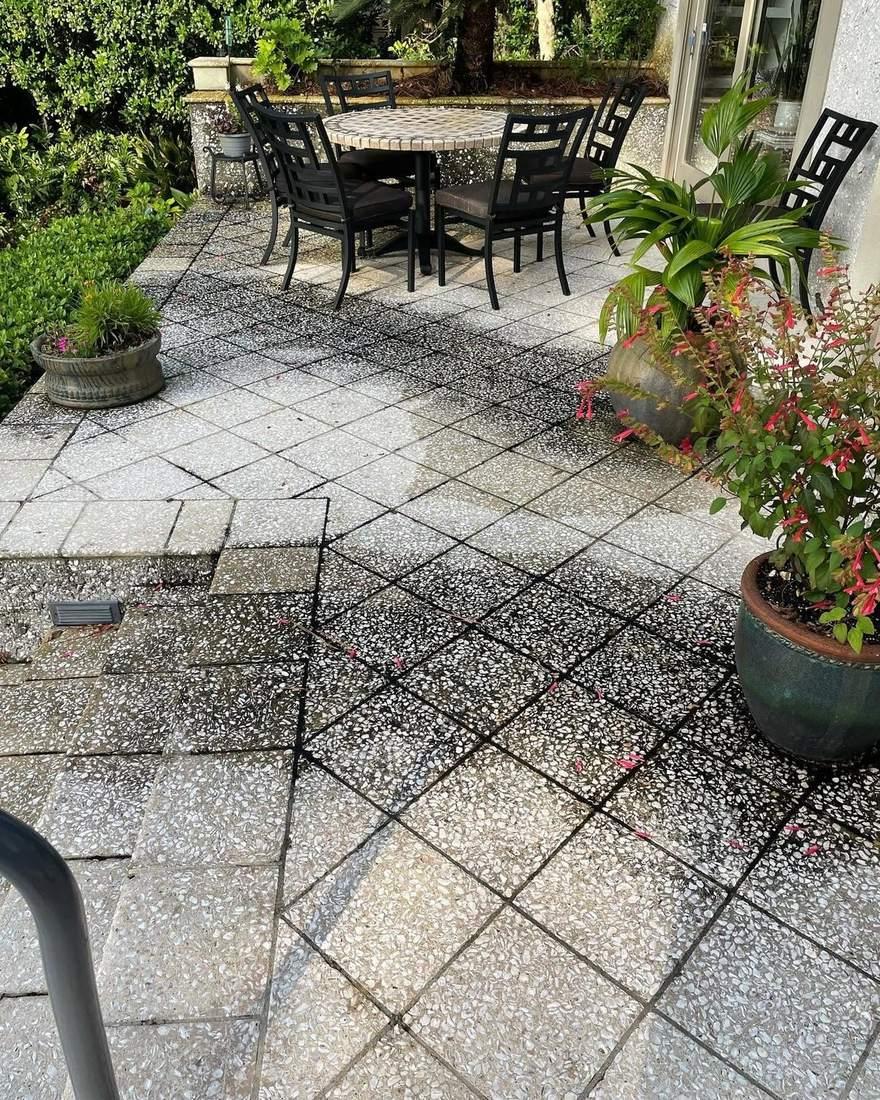 Paver patio halfway through pressure washing in Brunswick, GA