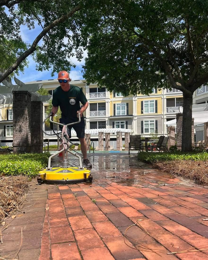 Rotary surface cleaner running on a brick paver walkway, Brunswick GA