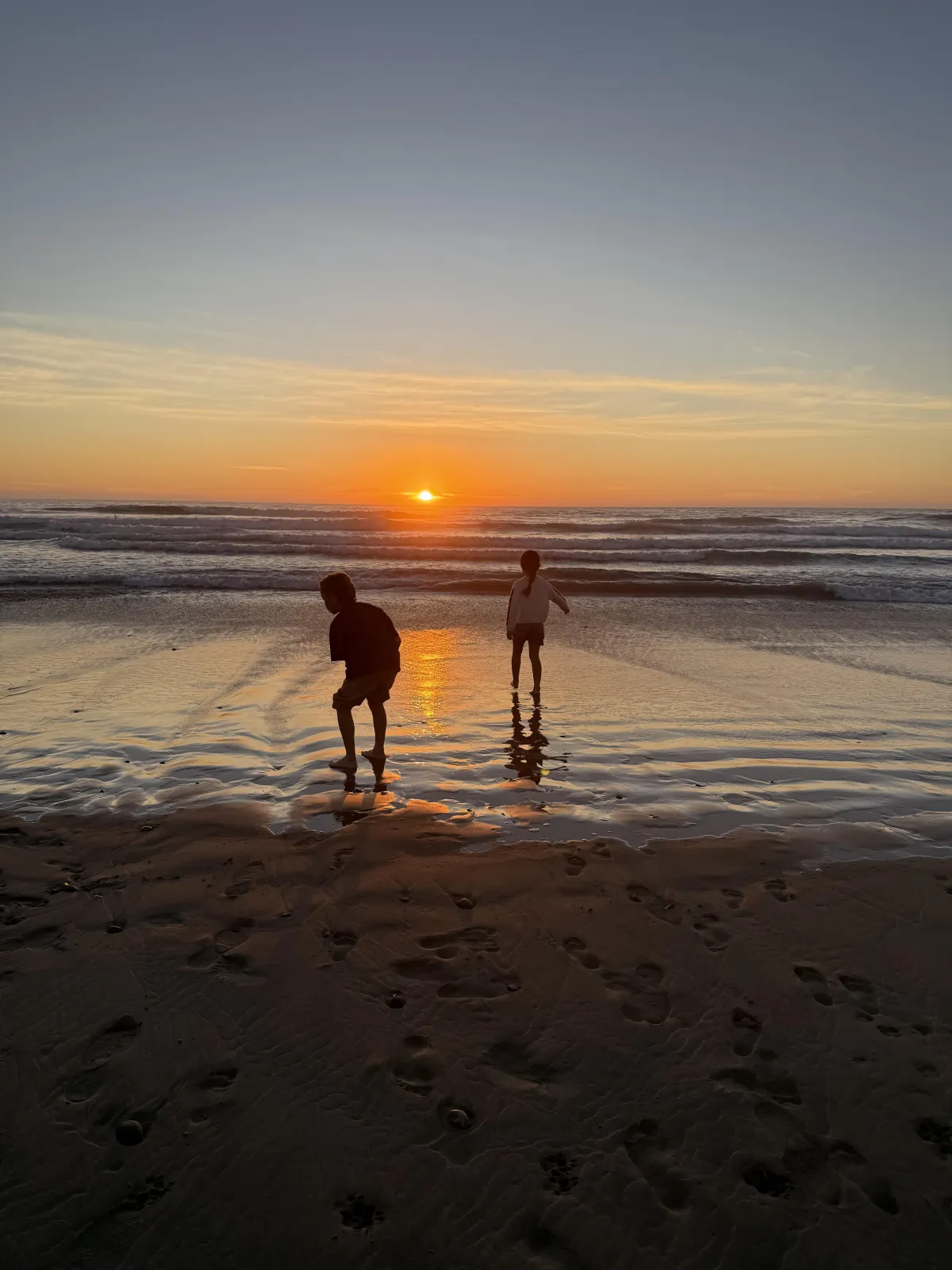 Elegant businesswoman reviewing financial documents in a marble-floored office with gold decor, exuding confidence and luxury.