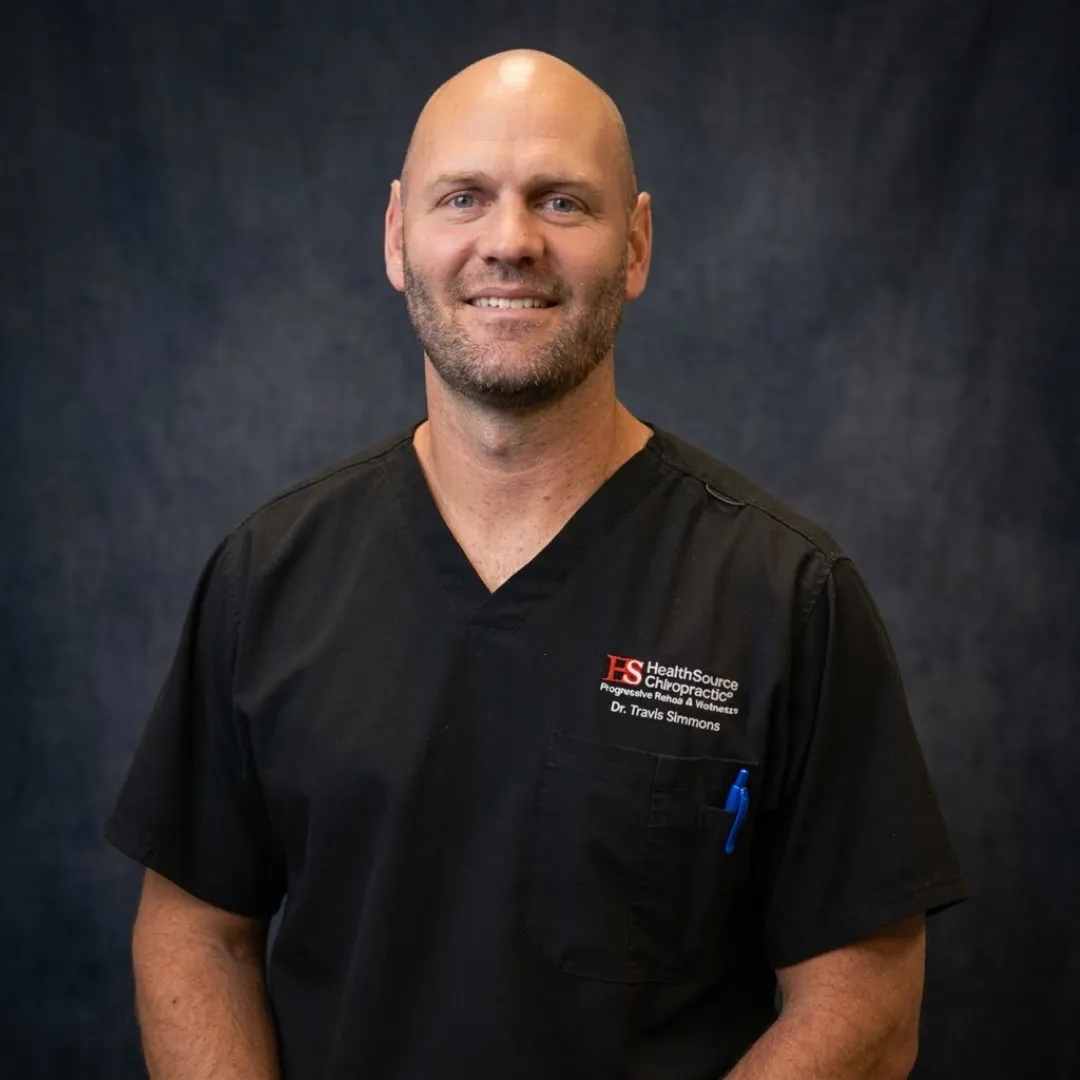 Professional headshot of Dr. Travis Simmons