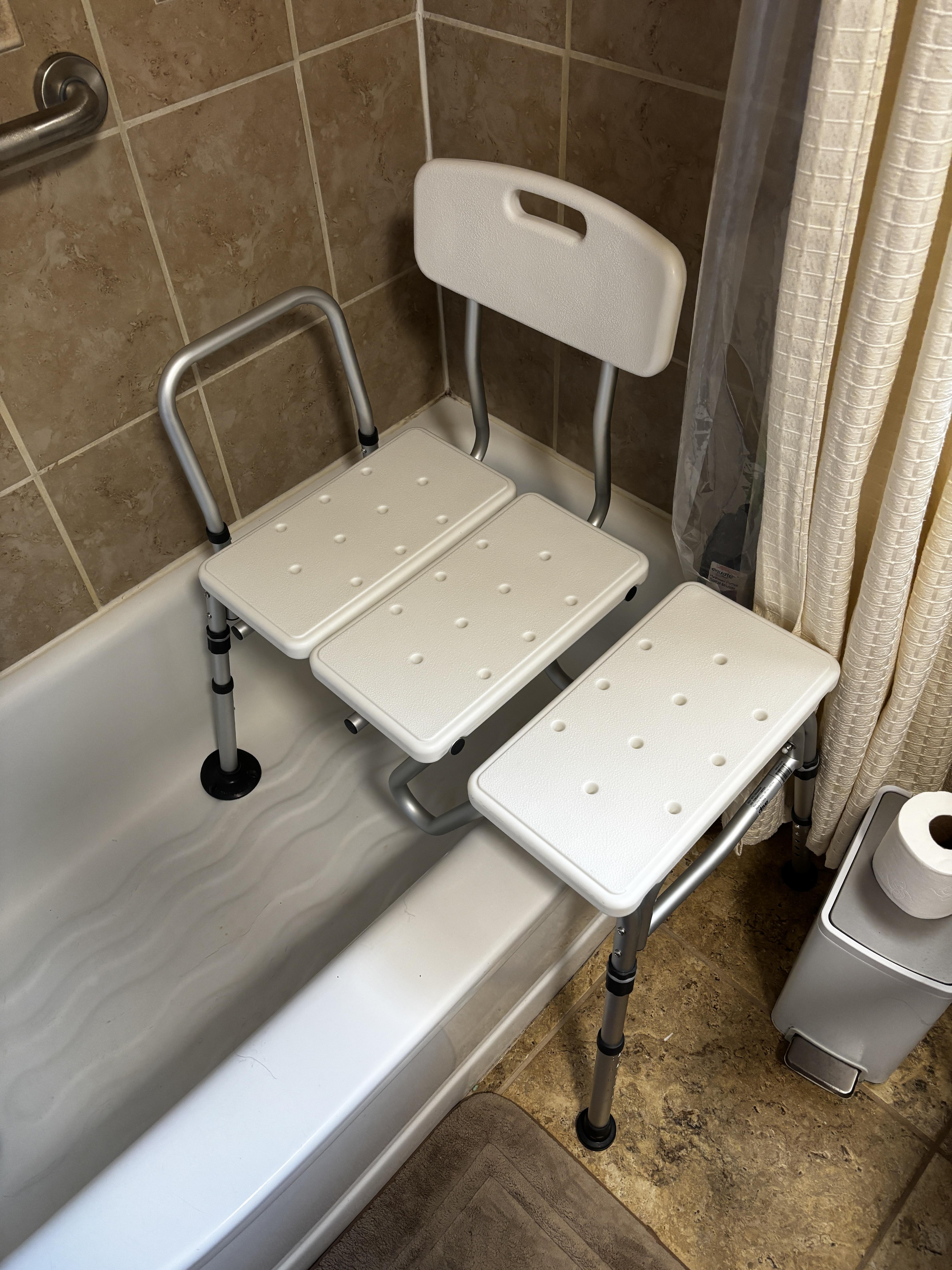 Tub transfer bench and grab bar installed for safe bathing