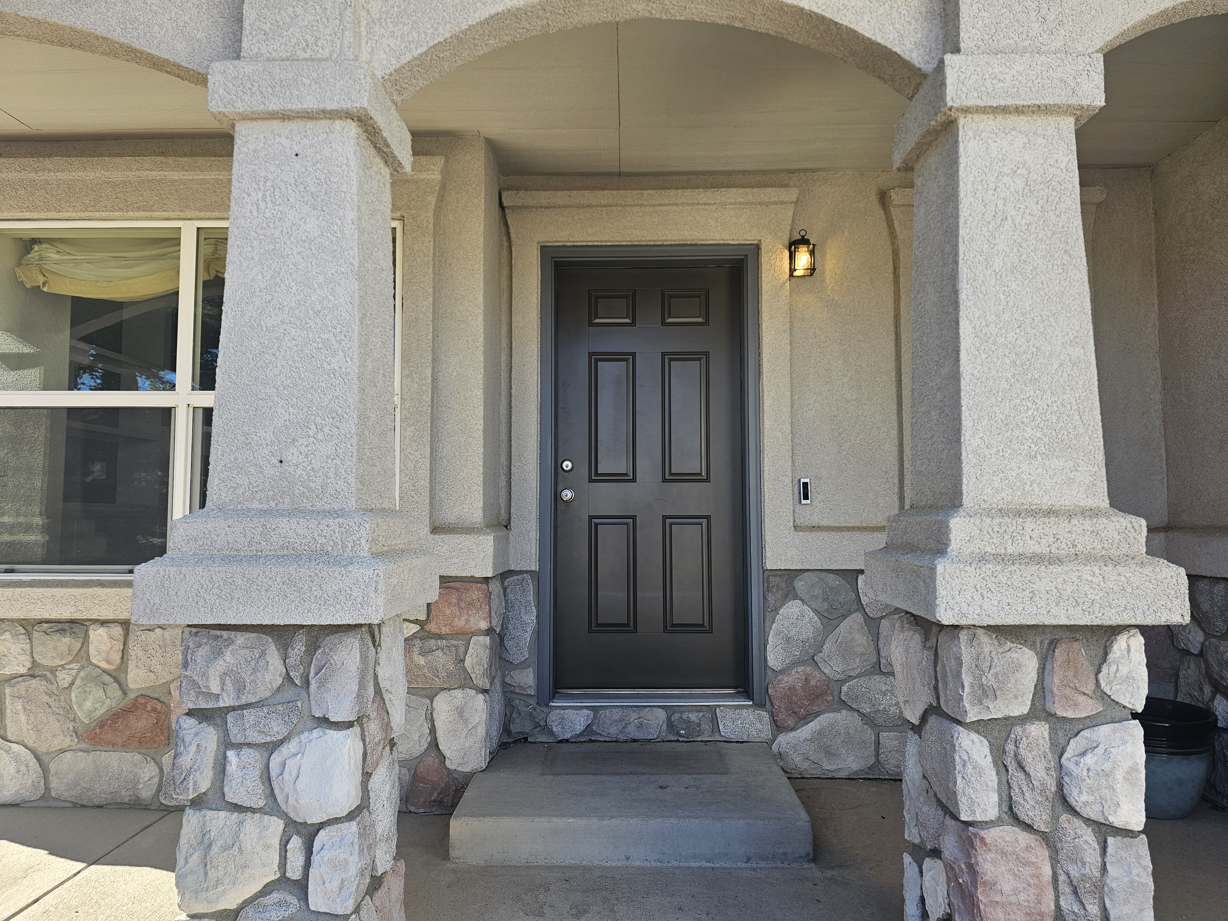 Front entrance of a stone-accented Colorado Springs home prepared for sale
