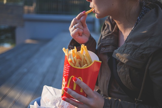 Man eating McDonald's fries