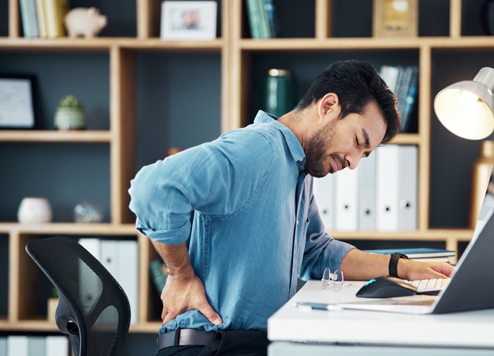 Man in house feeling neck pain