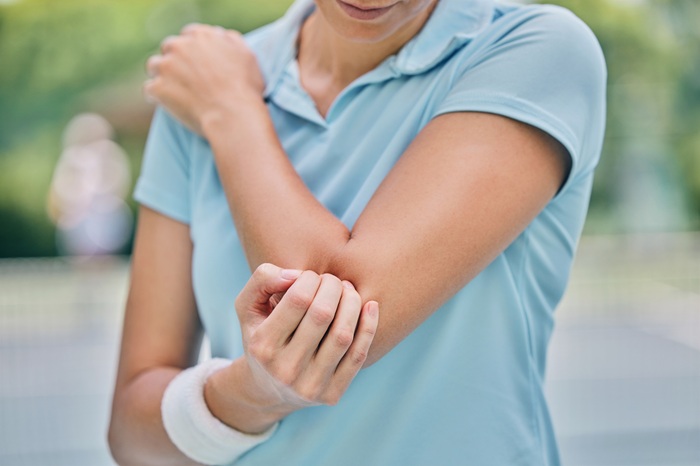 Tennis Women with Elbow Pain