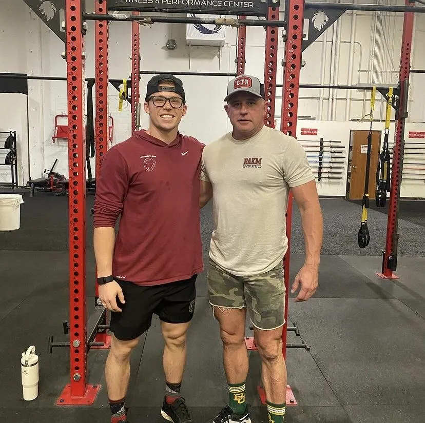 Personal Trainer and Masters Powerlifter take photo after a successful competition