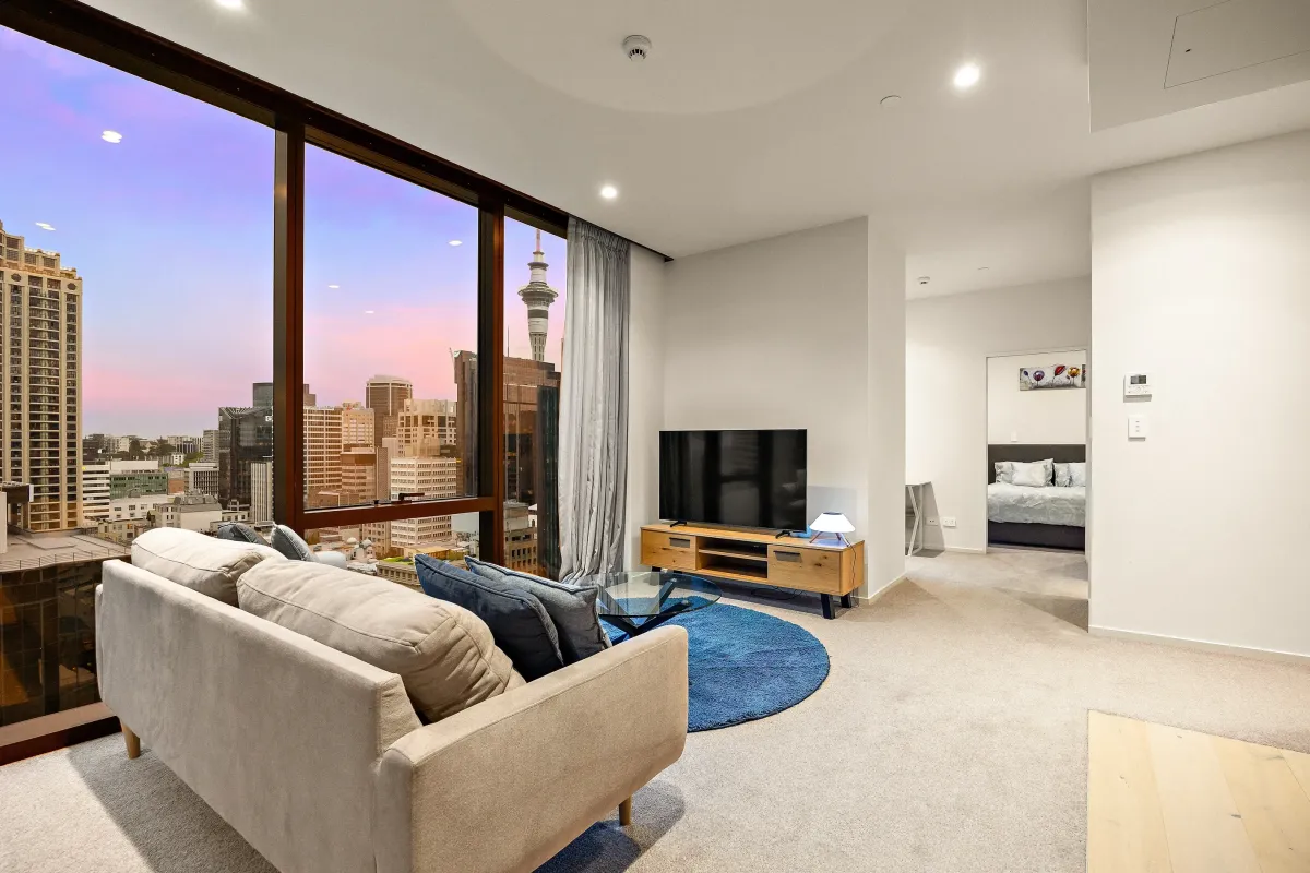 a black and white house with two black doors