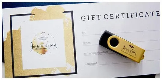 Gold USB flash drive on top of a gift certificate with Jamie Lynn Hypnotherapy logo