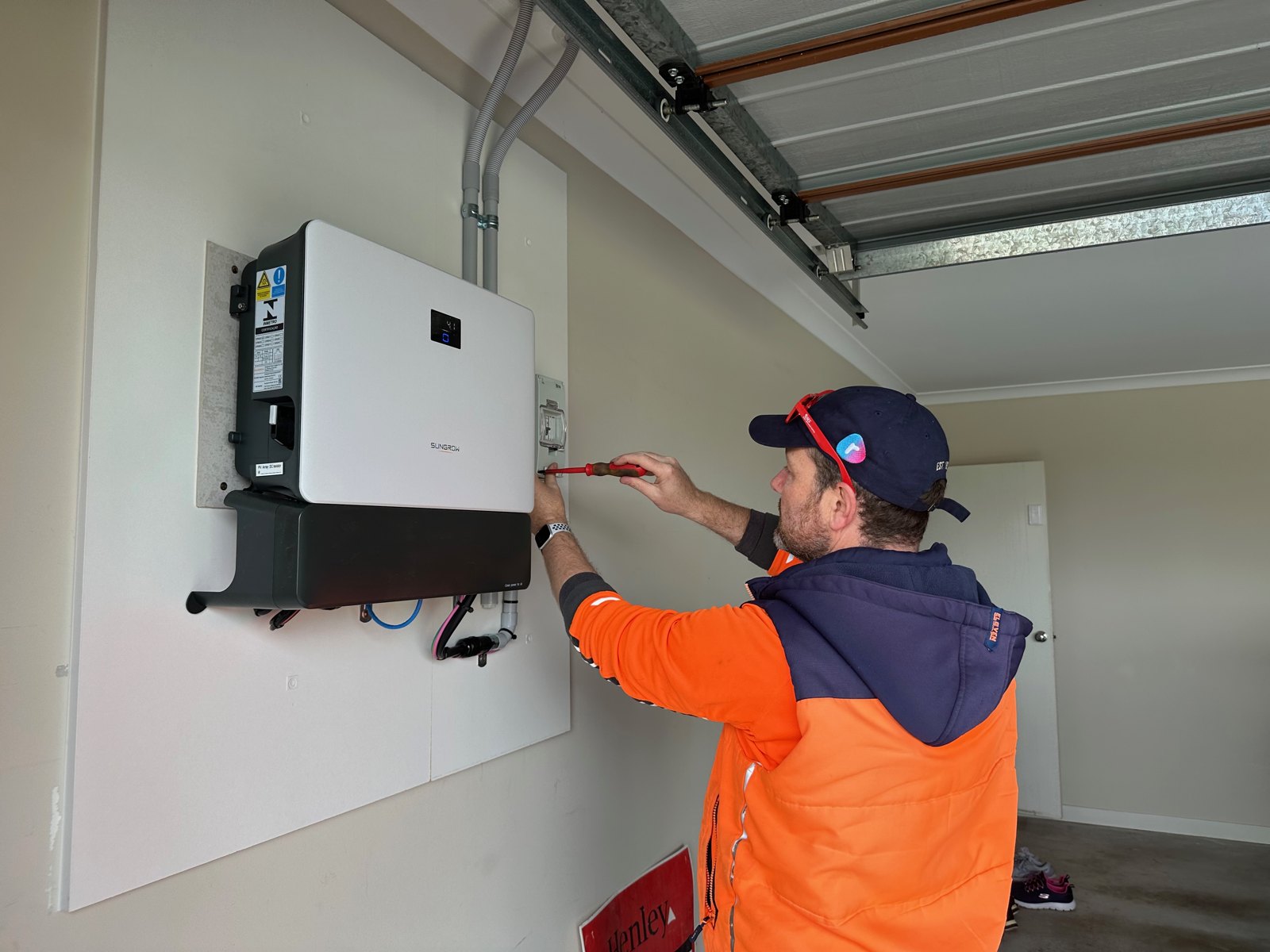 Pat Southwell inspecting a battery installation