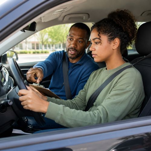 Driving instructor guiding a teen student through road test preparation in Bucks County, PA.