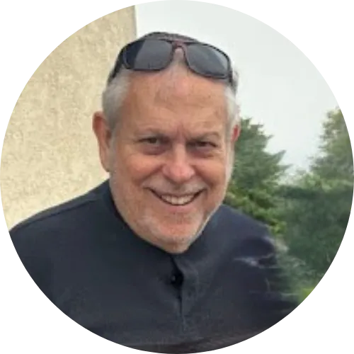 Herb Roth, founder and lead driving instructor of Cameo Driving School, smiling outdoors in a circular profile photo.