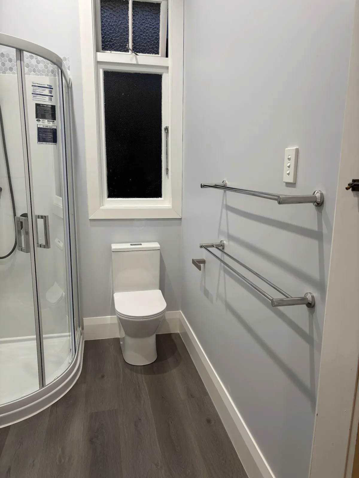 Freshly painted bathroom in Dunedin with clean white walls and modern finish by Maka Makeovers Ltd.