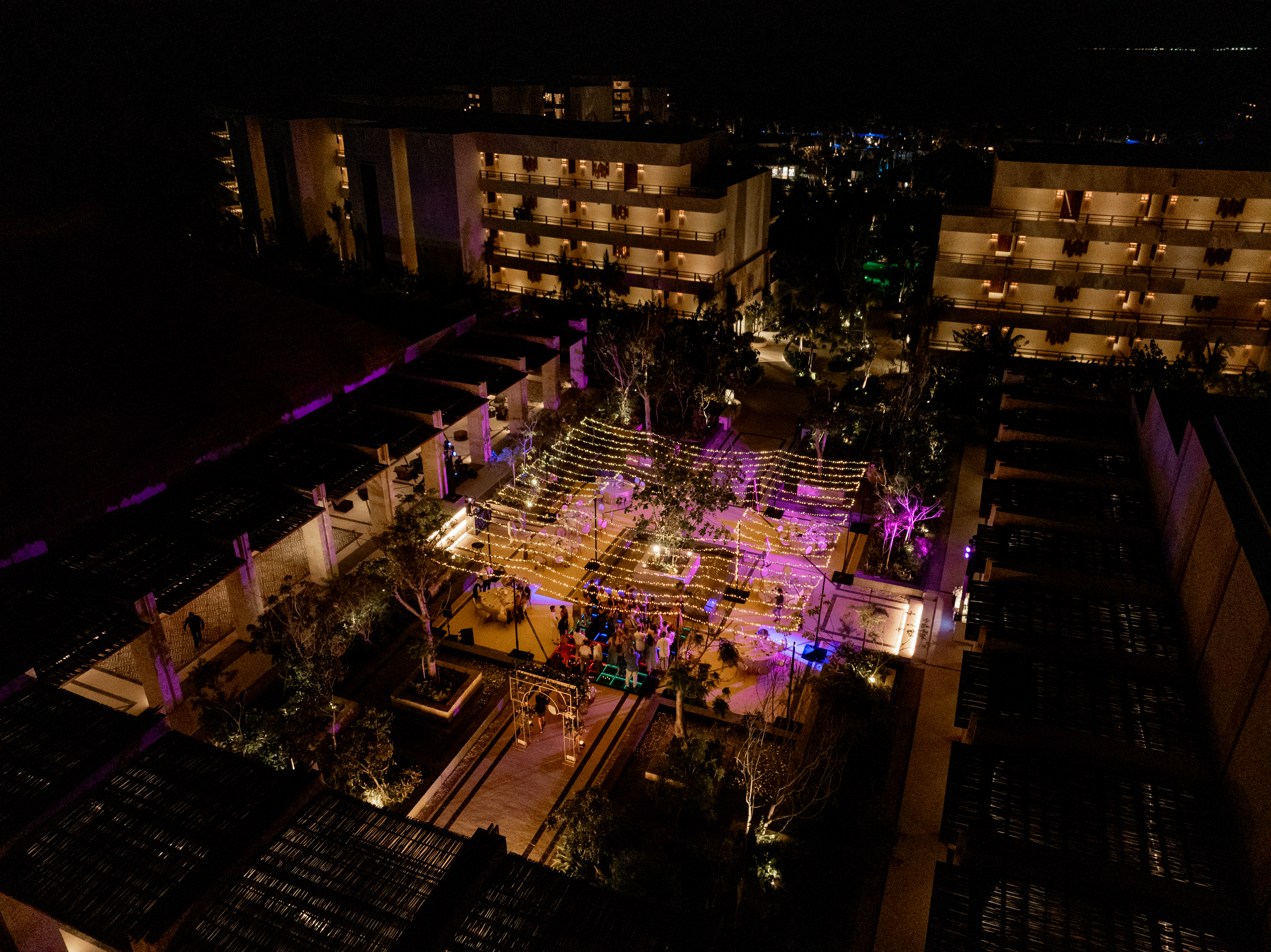 A beautiful night event with lights and tables.