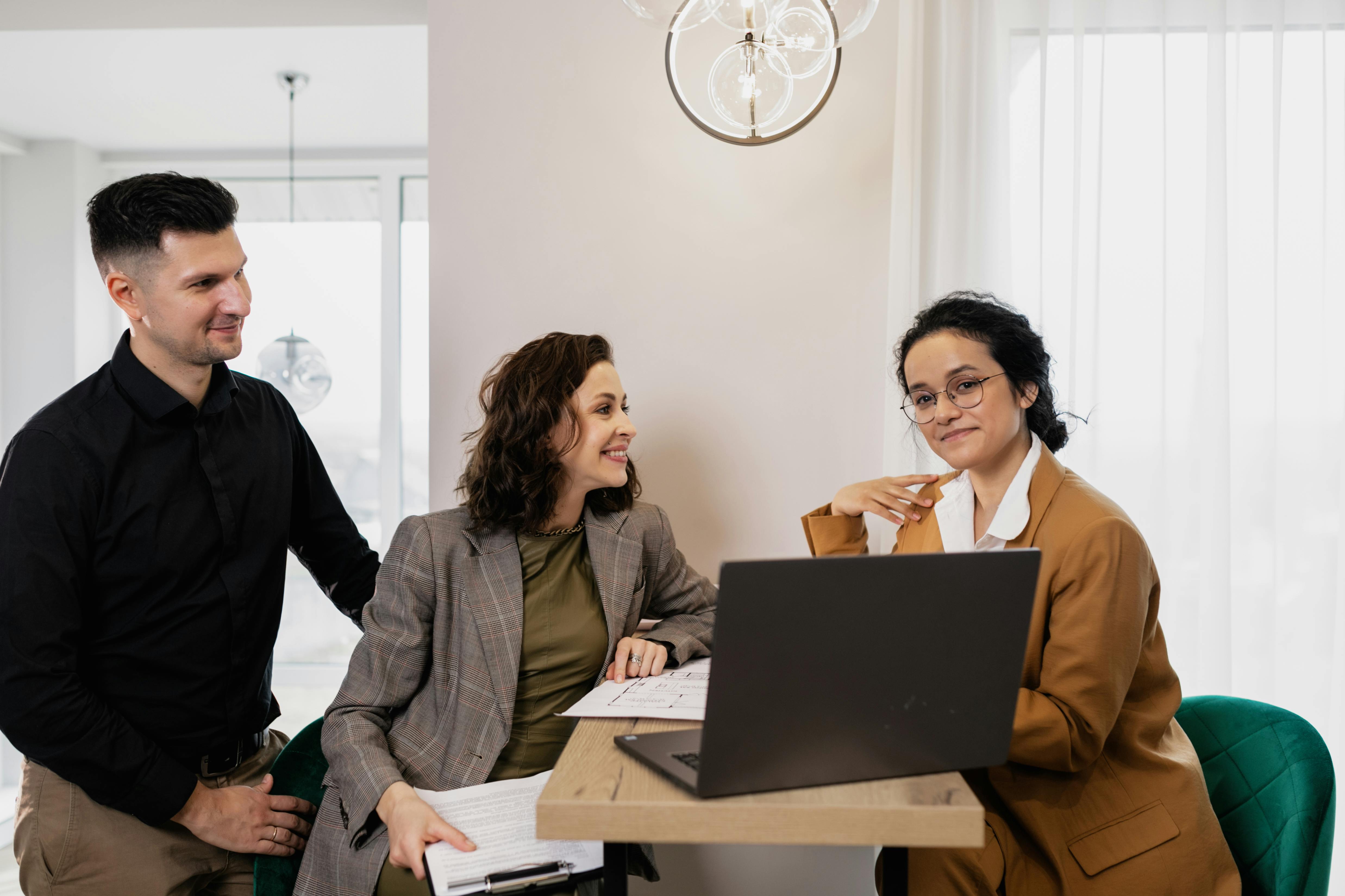Photorealistic team photo of a diverse professional group — White, African American, and Hispanic individuals — collaborating in an office, each person distinct and unique