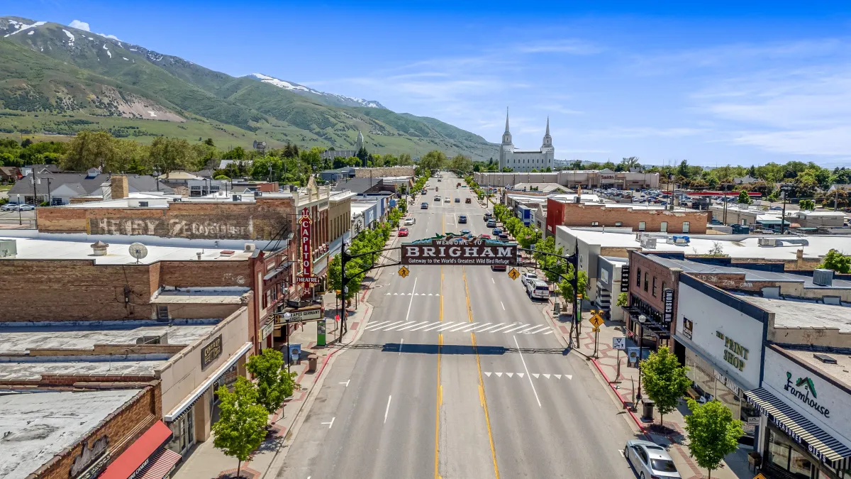 a modern house with a walkway leading to the front door