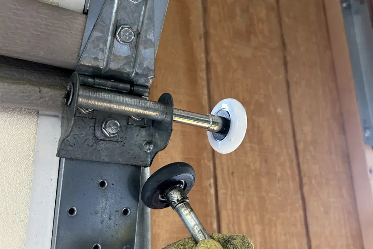 Lubricating garage door rollers to fix a noisy door in Chesapeake VA