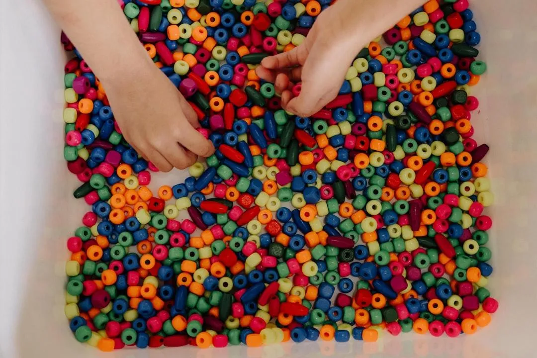 Child waves at laptop