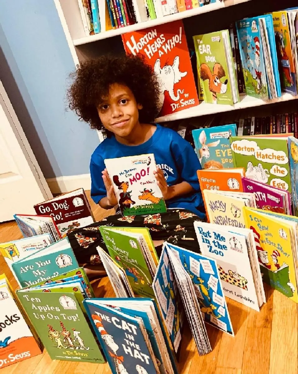 Girl watches a lesson about the alphabet on a laptop