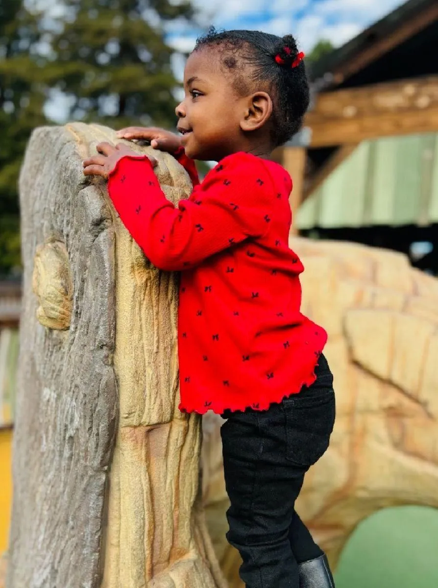 Girl follows directions during arts and crafts time.