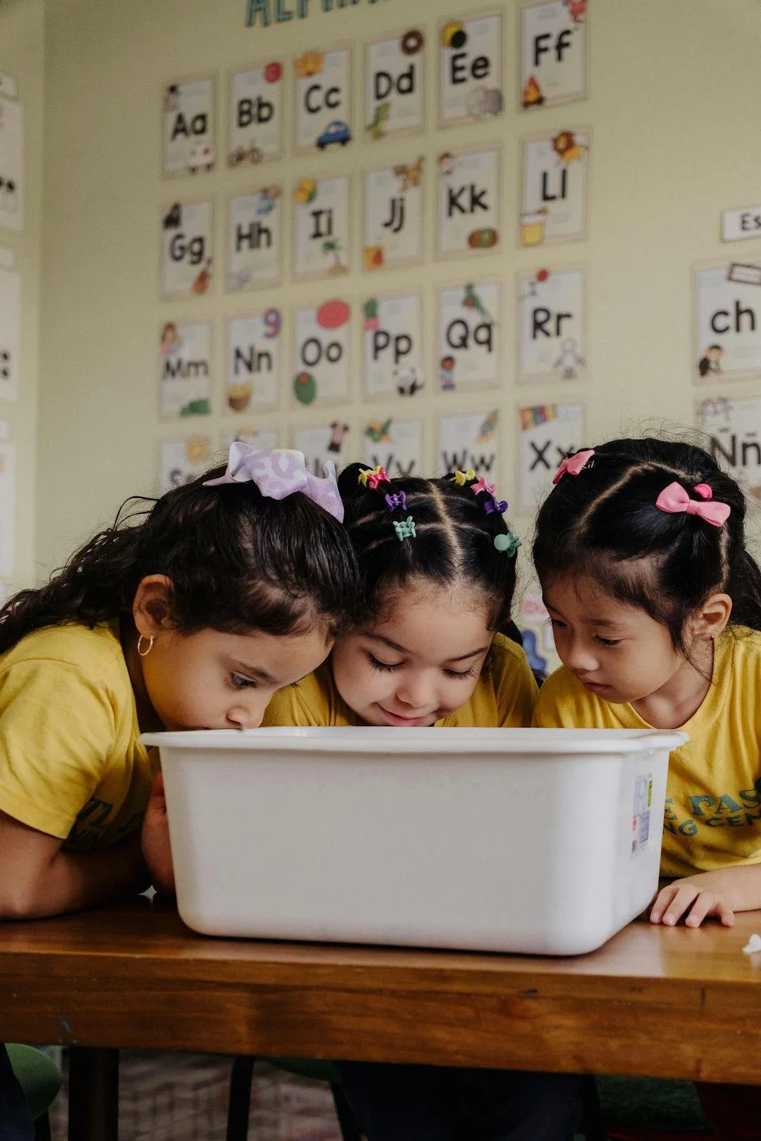 Child waves at laptop