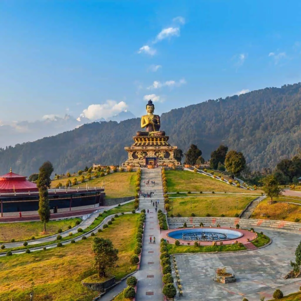 Wide landscape of a sunrise mountain ridge with a solitary walker in silhouette, 3:2 framing to communicate spaciousness and personal growth themes, crisp clarity and natural colors.