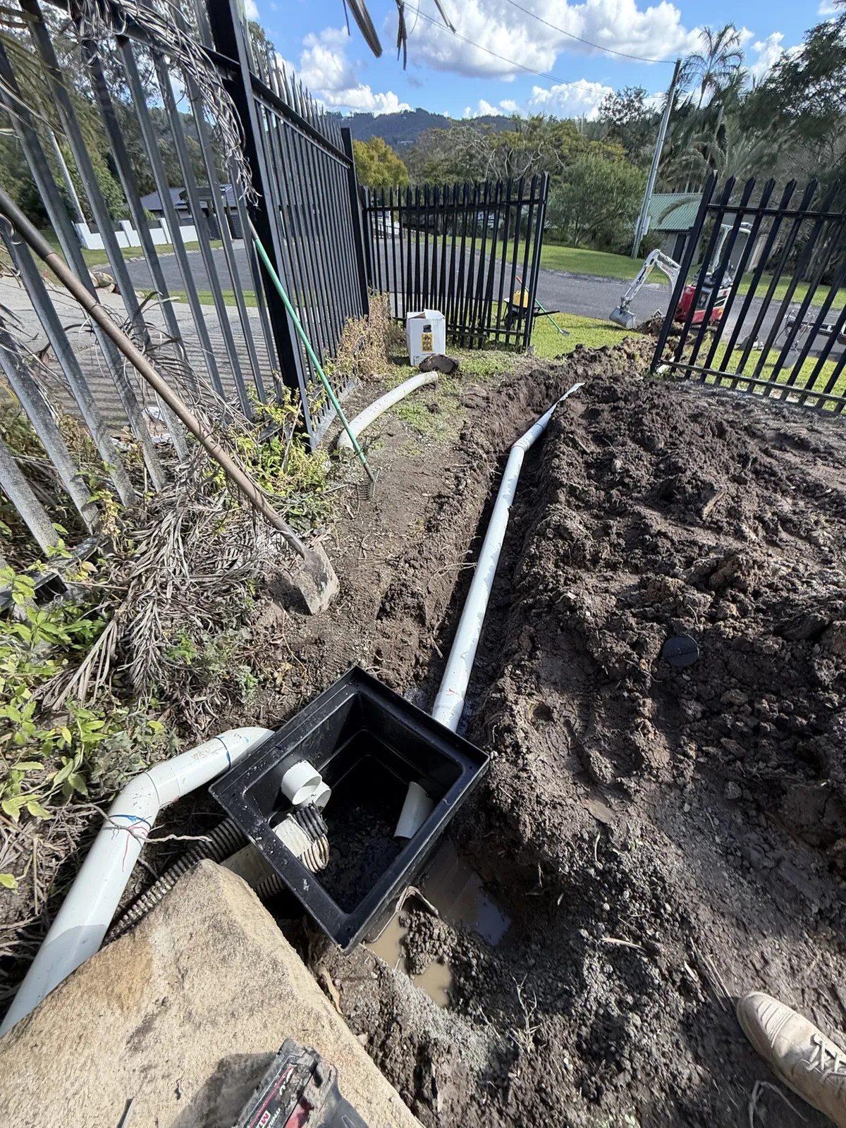Simfield Services commercial plumber installing a water meter on the Gold Coast