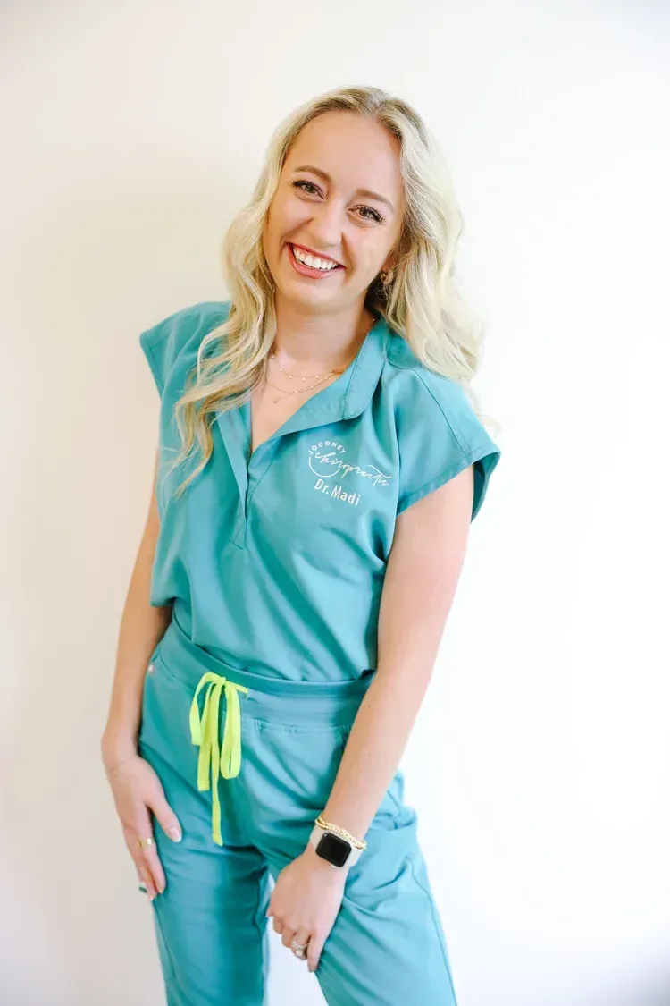 DR. MADI UHING-LARKEY, D.C.
